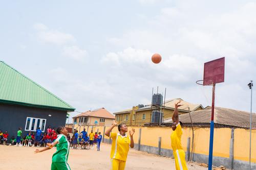 College students playing basketball