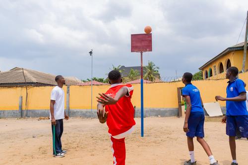 College students playing basketball