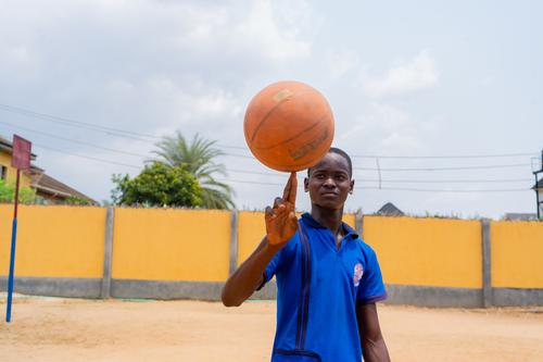 College students playing basketball