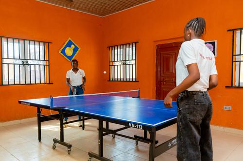 College female students playing table tennis