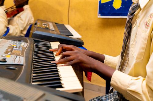 Student playing keyboard in Music class