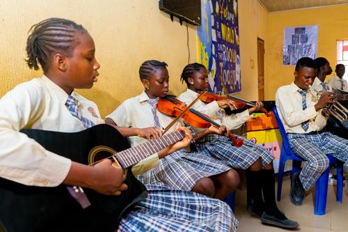 Students playing instruments in Music class