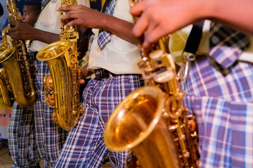 College students playing instruments during music class