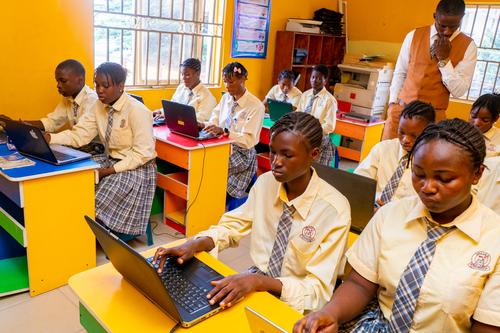 Male and female students working on computers in the Computer Laboratory