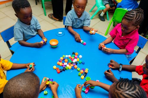 Nursery pupils learning with educational toys