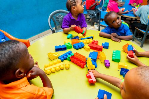 Nursery pupils learning with building blocks