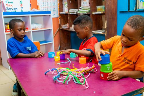 Nursery pupils learning with educational toys