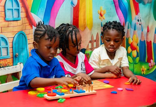 Nursery pupils learning with educational toys