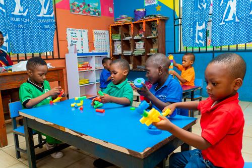 Nursery pupils learning with educational toys