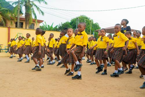 Nursery cross section of pupils marching on the assembly ground