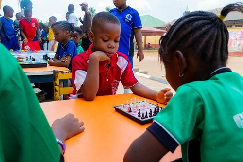 Primary students playing chess
