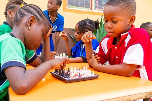 Primary students playing chess