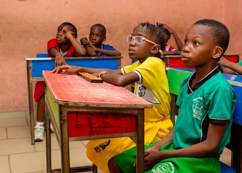 Pupils learning in a classroom