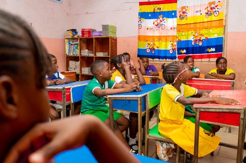 Primary pupils learning in a classroom