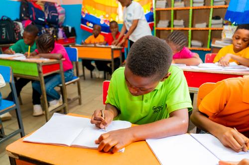 Primary pupils learning in a classroom