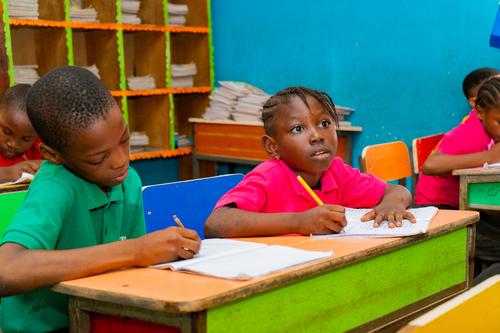 Primary pupils learning in a classroom