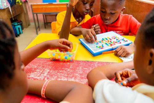 Primary pupils learning with educational toys