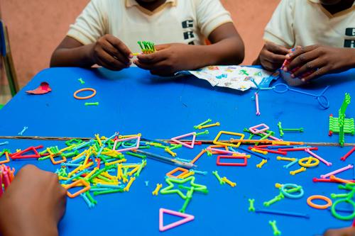 Primary pupils learning with educational toys