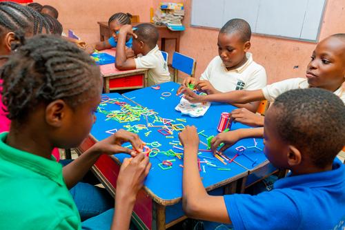 Primary pupils learning with educational toys