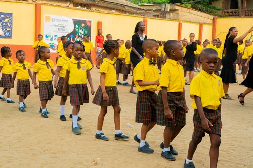 Primary male pupils marching to their classes