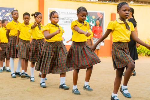 Primary female pupils marching to their classes