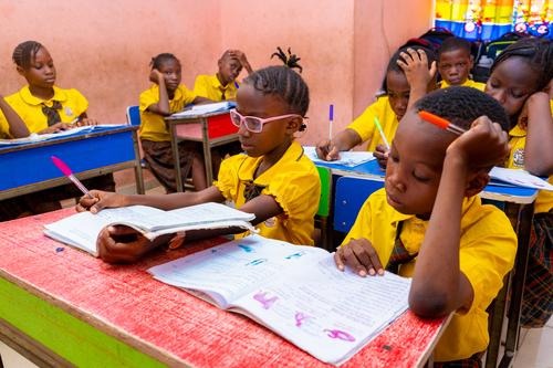Primary students reading in the classroom