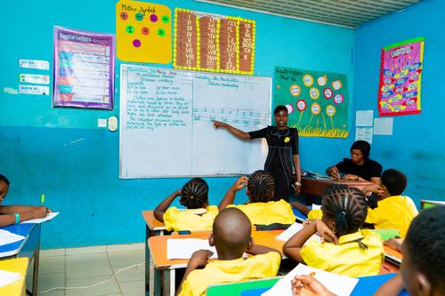 Female teacher explaining to students