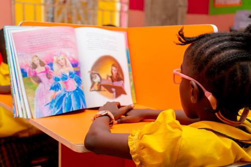 Side view of a female primary student in the school library
