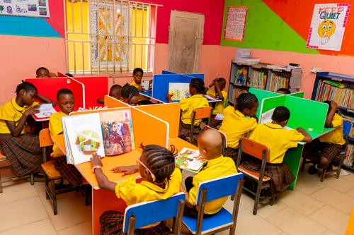 A cross-section of primary pupils studying in the school library