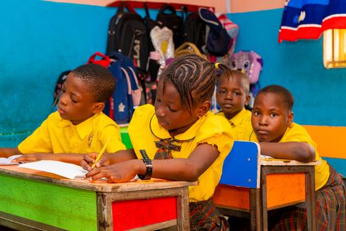 Primary pupils taking lessons in the classroom