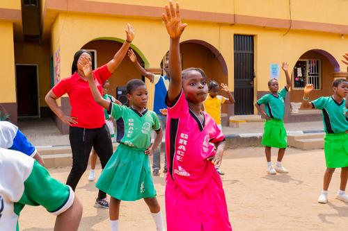 Primary students doing sports exercises