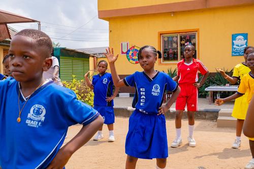 Primary students doing sports exercises